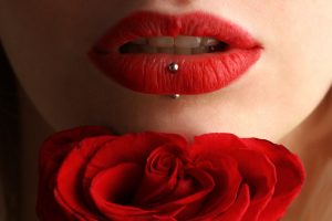 woman's lips over a flower